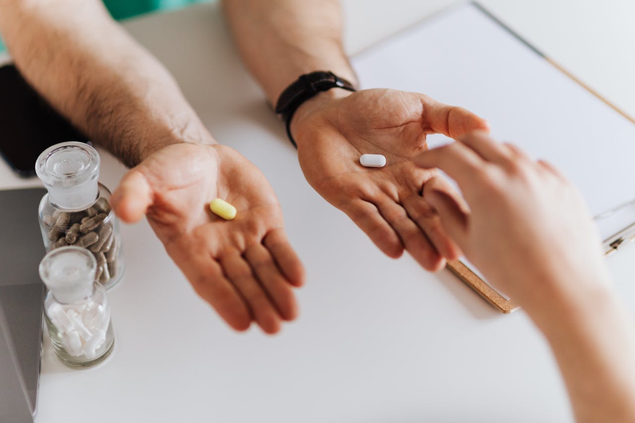 Crafting Captivating Headlines: Your awesome post title goes here From above anonymous female and unrecognizable doctor man giving yellow and white tablets for choosing while working in modern clinic